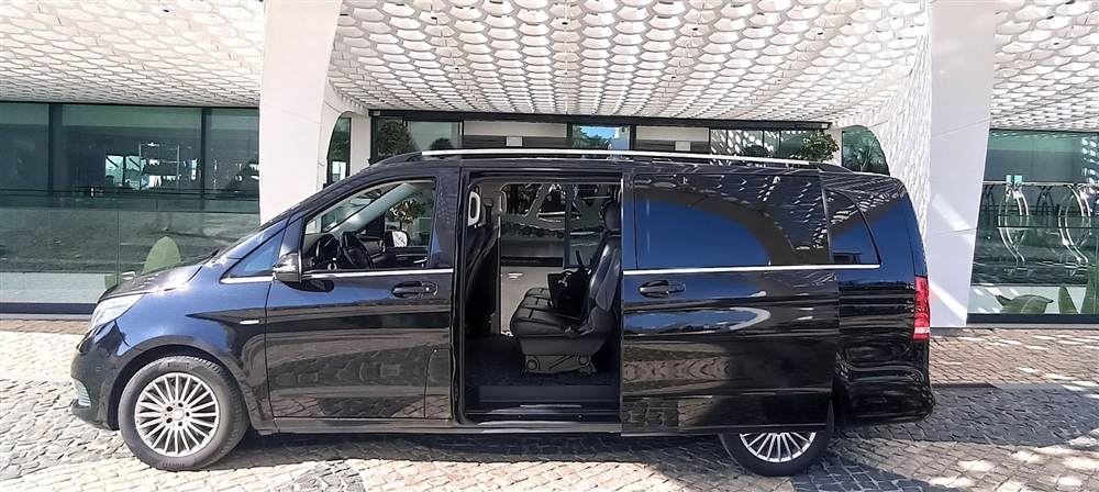Mercedes-Benz V-Class with the sliding door open, showing the leather seats